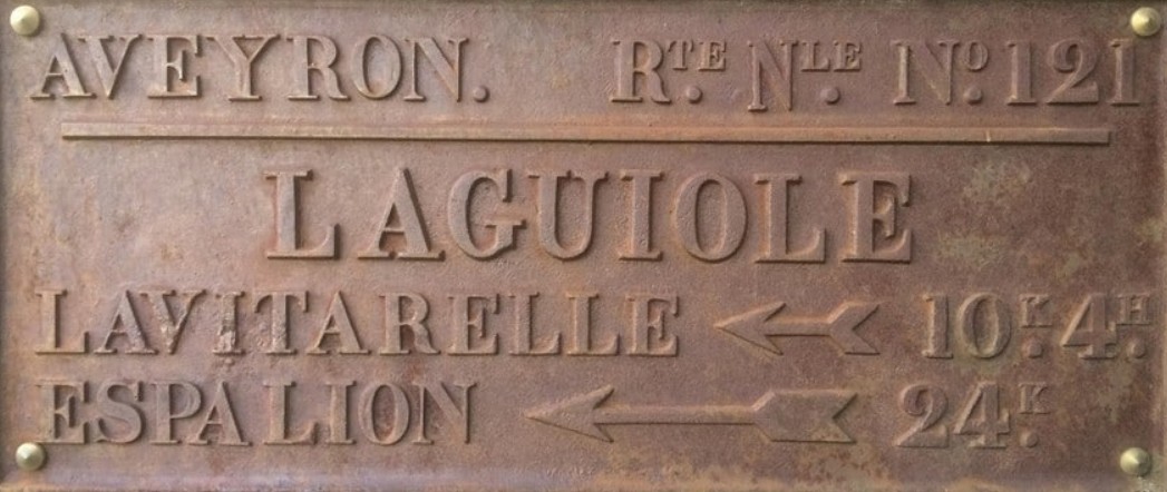 Entrance sign of Laguiole village Road sign of the village of Laguiole in Aveyron France